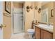 Bathroom features a glass enclosed shower, tile flooring, and stylish decorative accents at 9640 S Johnson St, Littleton, CO 80127