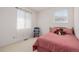 Bright bedroom featuring a twin bed and a rocking chair by the window at 9640 S Johnson St, Littleton, CO 80127