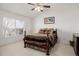 Cozy bedroom with vaulted ceiling, large window, and comfortable bedding at 9640 S Johnson St, Littleton, CO 80127