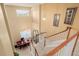 Grand foyer with staircase, chandelier, and view of the adjacent dining area at 9640 S Johnson St, Littleton, CO 80127