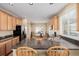 Open kitchen featuring granite countertops, stainless steel appliances, and ample cabinet space at 9640 S Johnson St, Littleton, CO 80127