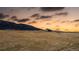 A scenic landscape view of a mountain range and golden sunset at 9640 S Johnson St, Littleton, CO 80127