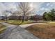 Outdoor playground area with climbing structures, slides, and walking paths at 9640 S Johnson St, Littleton, CO 80127