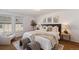 Bright, spacious bedroom featuring a cozy sitting area and stylish decor at 2891 W Long Dr # D, Littleton, CO 80120