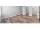 Spacious bedroom featuring wood-look flooring and ample closet space at 3656 S Depew St # 104, Denver, CO 80235
