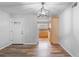 Bright dining area with wood-look floors and kitchen access at 3656 S Depew St # 104, Denver, CO 80235