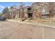 Brick building exterior with parking and landscaping at 3656 S Depew St # 104, Denver, CO 80235