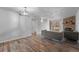 Living room with hardwood floors and fireplace at 3656 S Depew St # 104, Denver, CO 80235