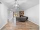 Open living room with hardwood floors and fireplace at 3656 S Depew St # 104, Denver, CO 80235