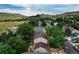 An aerial view from above highlights a community with well-maintained homes and landscaping nestled in a green valley at 312 Allen St, Golden, CO 80401