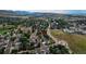 This aerial photo showcases the home's setting near a roundabout, green spaces, and residential streets at 312 Allen St, Golden, CO 80401