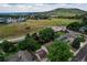 Aerial view of a neighborhood with a central roundabout and beautiful mountain views in the distance at 312 Allen St, Golden, CO 80401