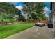 Relax in this sprawling backyard oasis with lush green grass and patio furniture at 312 Allen St, Golden, CO 80401