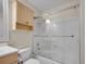 Bathroom with a vanity, toilet, and bathtub with shower; a small linen closet is above toilet at 312 Allen St, Golden, CO 80401