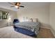 Inviting bedroom with a stylish bed, a cozy blue chair, and a large window, providing a comfortable living space at 312 Allen St, Golden, CO 80401