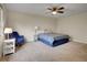 Comfortable bedroom featuring a ceiling fan, chair, and patterned bedspread at 312 Allen St, Golden, CO 80401