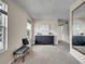 Bedroom featuring a bench, dresser, mirror, and a sliding barn door into the next room at 312 Allen St, Golden, CO 80401