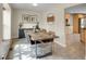 Elegant dining room featuring a distinctive wooden table, seating for four, and modern lighting, ideal for dinners at 312 Allen St, Golden, CO 80401