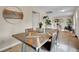 Charming dining room with a unique wooden table, seating for six, and stylish decor, perfect for gatherings at 312 Allen St, Golden, CO 80401