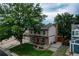 Exterior view of home with a large tree, landscaped yard, and driveway at 312 Allen St, Golden, CO 80401