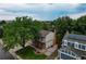 Exterior view of home with a large tree and landscaped yard at 312 Allen St, Golden, CO 80401