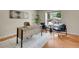 Bright home office featuring a modern desk, comfortable chairs, and a large window with outdoor views at 312 Allen St, Golden, CO 80401