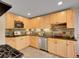Modern kitchen features light wood cabinetry, granite countertops, and stainless steel dishwasher at 312 Allen St, Golden, CO 80401
