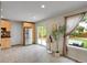 Bright eat-in kitchen with stainless steel refrigerator and sliding glass doors to backyard patio at 312 Allen St, Golden, CO 80401