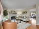 Cozy living room with a painted brick fireplace, hardwood floors, and ample natural light at 312 Allen St, Golden, CO 80401