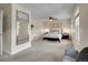 Spacious bedroom with a comfortable bed, ceiling fan, and ample natural light, offering a relaxing atmosphere at 312 Allen St, Golden, CO 80401