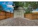 Enclosed storage shed surrounded by a privacy fence and gravel at 312 Allen St, Golden, CO 80401