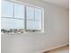 Bright bedroom with a view, features neutral walls and carpet providing a serene retreat at 3464 N Irvington St, Aurora, CO 80019