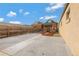 Backyard with concrete patio, mulched area, a wooden fence and well-maintained landscaping at 756 Kalamath St, Denver, CO 80204