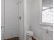Cozy bathroom featuring a tiled shower, sleek toilet, and unique patterned floor at 756 Kalamath St, Denver, CO 80204