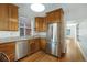 Well-equipped kitchen featuring stainless steel appliances and light wood cabinetry at 756 Kalamath St, Denver, CO 80204