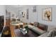 Open-concept living room featuring hardwood floors, modern furniture, and plenty of natural light at 756 Kalamath St, Denver, CO 80204