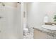 Clean bathroom with a shower, toilet, granite countertops, and modern fixtures at 3101 Blake St # 309, Denver, CO 80205