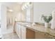 Bathroom featuring double sinks, granite countertops and scenic outdoor views at 3101 Blake St # 309, Denver, CO 80205