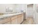 Bathroom featuring double sinks, granite countertops, and tiled floors at 3101 Blake St # 309, Denver, CO 80205