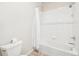 Bright bathroom featuring a shower and bathtub combo with tiled walls at 3101 Blake St # 309, Denver, CO 80205