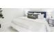 Comfortable bedroom with a plush bed, stylish pillows, and soft lighting at 3101 Blake St # 309, Denver, CO 80205