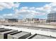 Expansive city view from rooftop offering clear skies and a view of urban buildings on the horizon at 3101 Blake St # 309, Denver, CO 80205