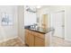 Close-up of kitchen island and cabinets with granite countertops and bar seating at 3101 Blake St # 309, Denver, CO 80205