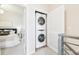Convenient laundry area featuring a stacked washer and dryer at 3101 Blake St # 309, Denver, CO 80205
