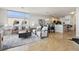 Cozy living room featuring modern decor with hardwood flooring flowing into an open kitchen at 3101 Blake St # 309, Denver, CO 80205