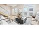 Open floor plan living room featuring hardwood floors, comfortable seating, and ample natural light at 3101 Blake St # 309, Denver, CO 80205