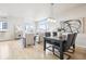 Bright, open-concept living room with light wood floors, large windows, and modern decor at 3101 Blake St # 309, Denver, CO 80205