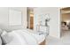 Bright bedroom with a walk-in closet and doorway to ensuite bathroom at 3101 Blake St # 309, Denver, CO 80205
