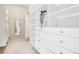 Bright walk-in closet with custom shelving, drawers and full-length mirror at 3101 Blake St # 309, Denver, CO 80205