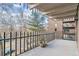 Enjoy the outdoors on this balcony, featuring metal railings and a view of trees and street at 460 S Marion Pkwy # 453, Denver, CO 80209